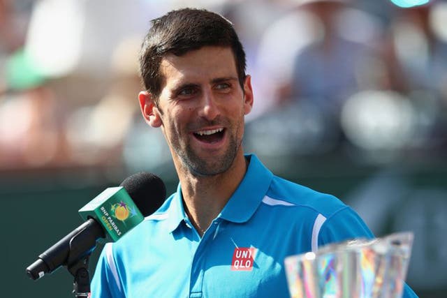 Novak Djokovic talks to the crowd after his win over Milos Raonic at Indian Wells
