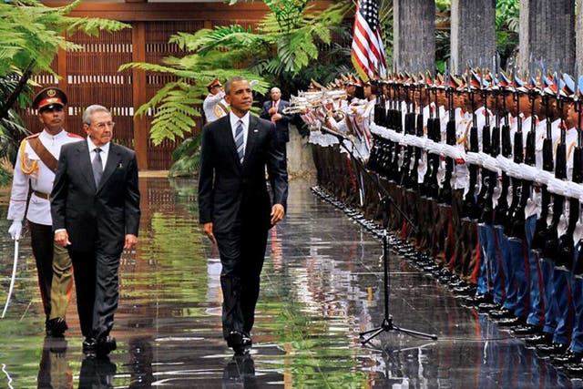 Cuban President Raul Castro and President Obama review the troops at the Revolution Palace in Havana on March 21, 2016