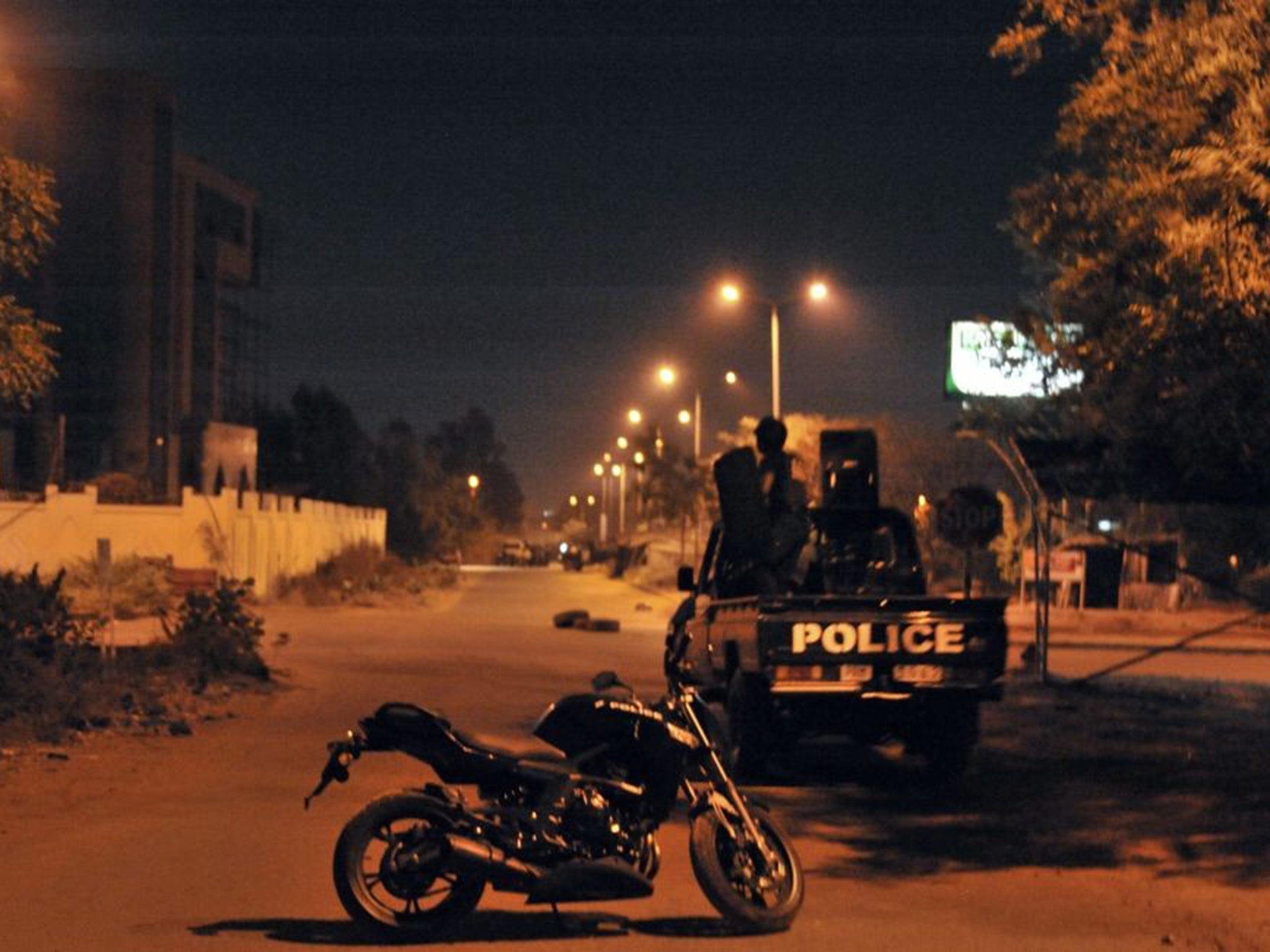 Malian police stand guard outside hotel housing EU military mission