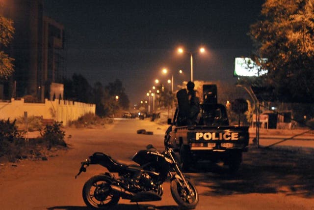 Malian police stand guard outside hotel housing EU military mission