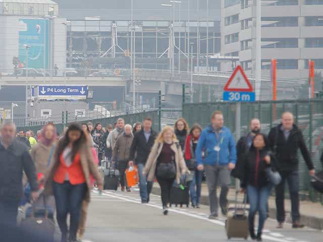 Passengers are evacuated from the terminal building after explosions at Brussels Airport in Zaventem near Brussels,