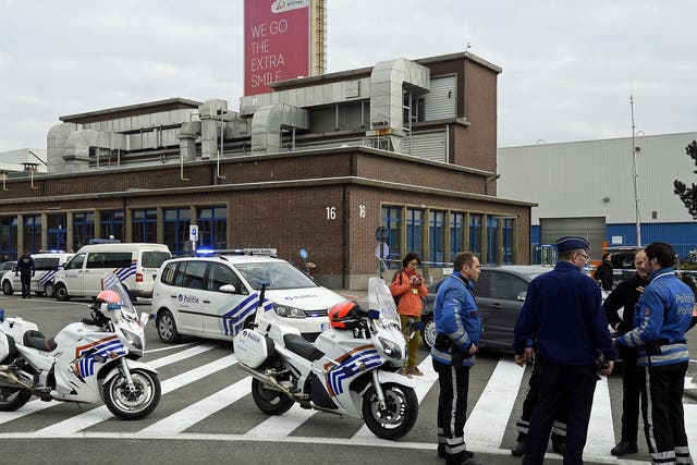 Belgian police officers stand guard at Brussels Airport, in Zaventem,