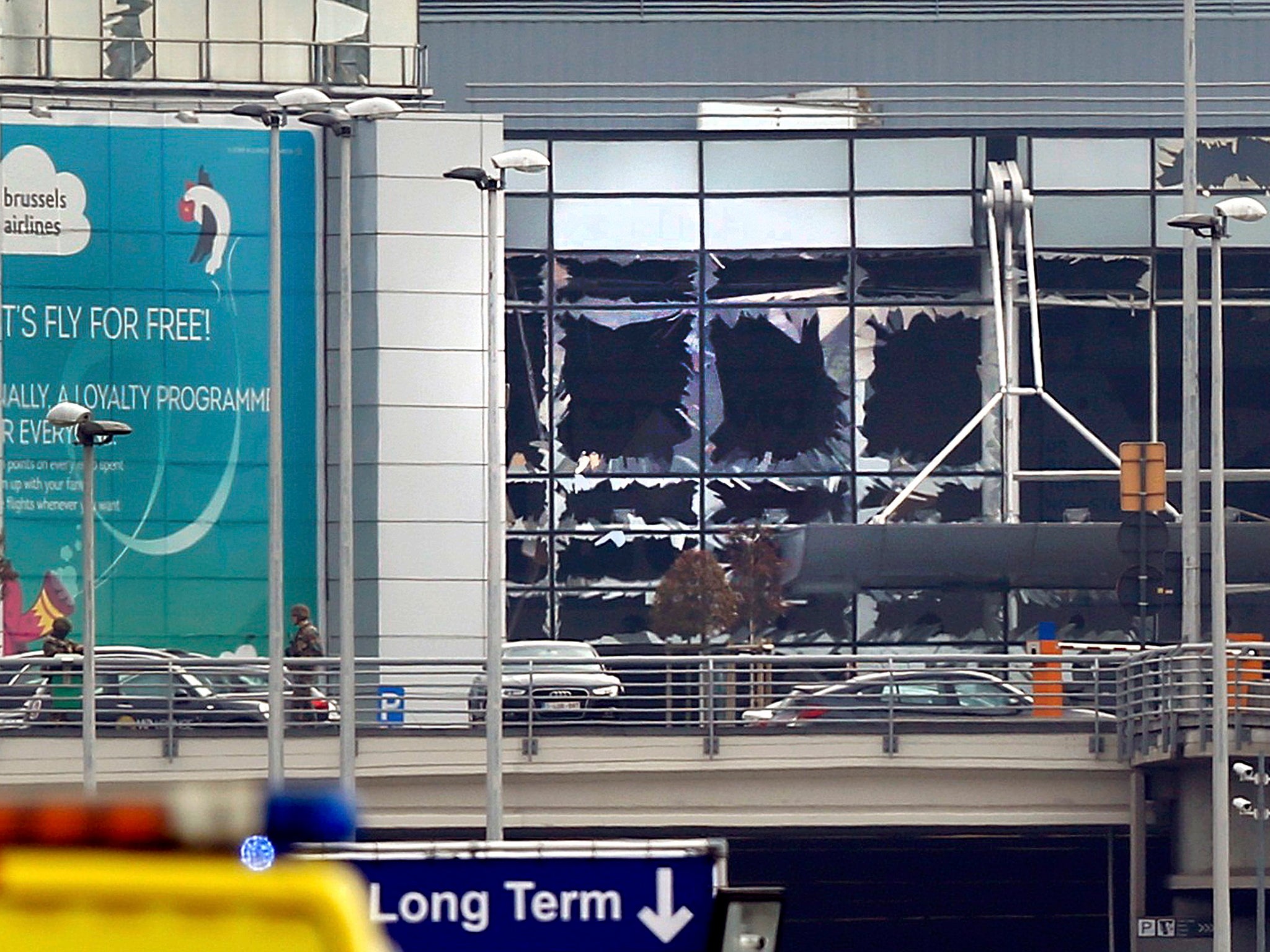 Broken windows seen at the scene of explosions at Zaventem airport near Brussels