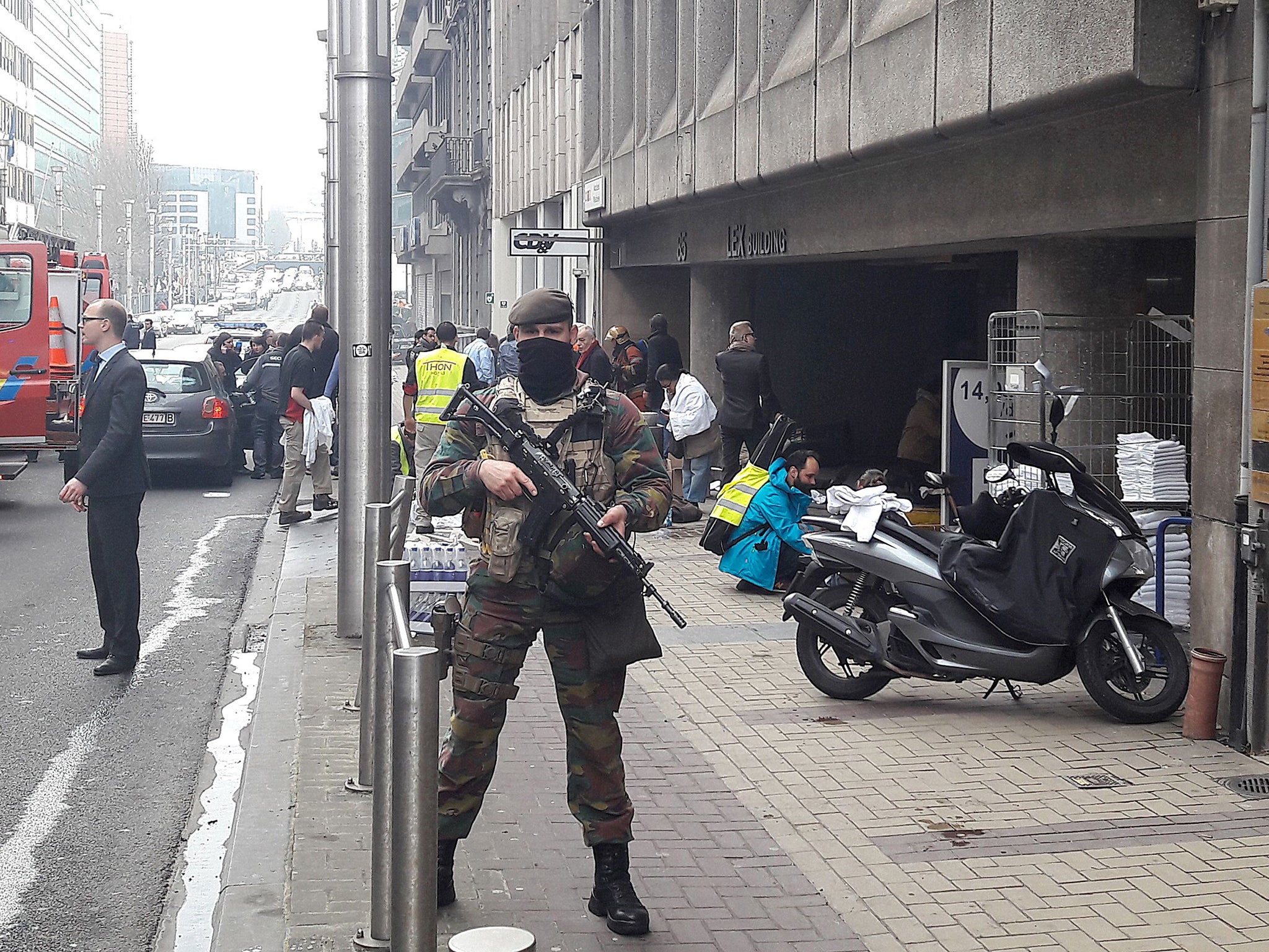 A Belgian soldier stands guard outside the Maalbeek metro station in Brussels after a blast at this station located near the EU institutions