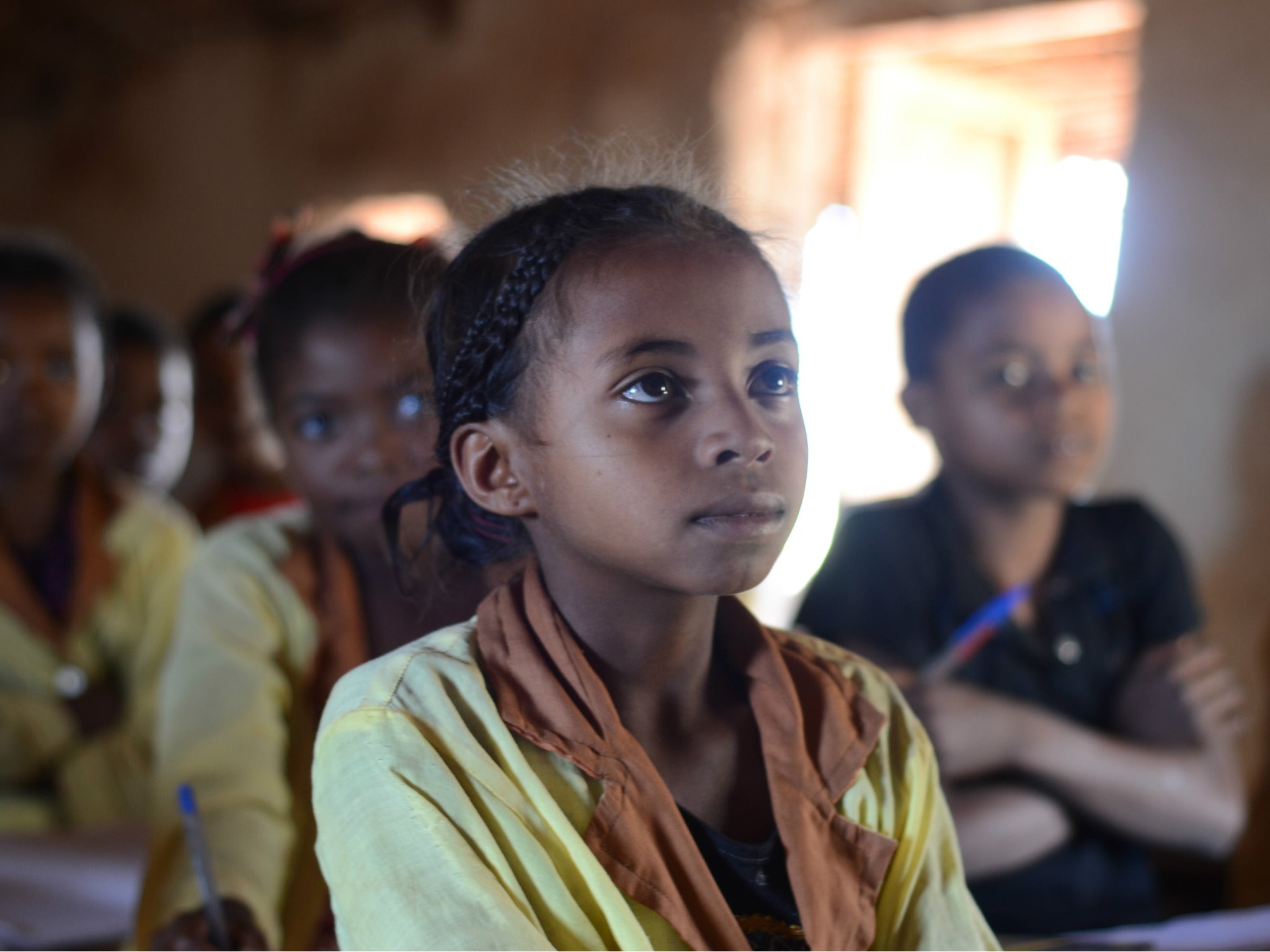 Onja, nine, attends classes in a school, without a water point; pupils fetch water from a nearby river to drink, and are frequently ill. Miarinarivo village, Analamanga region, Madagascar.