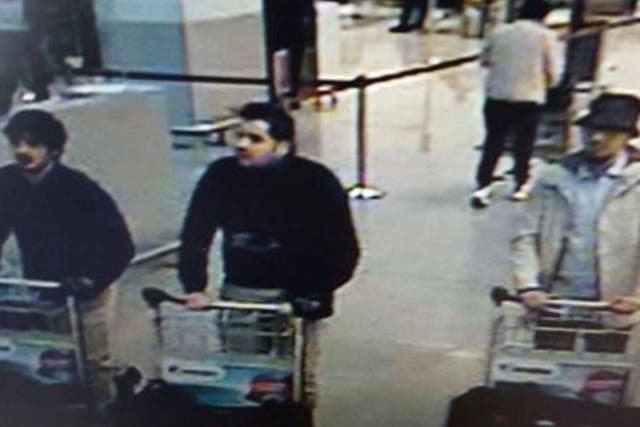 A picture released on March 22, 2016 by the belgian federal police on demand of the Federal prosecutor shows a screengrab of the airport CCTV camera showing three suspects of this morning's attacks at Brussels Airport, in Zaventem