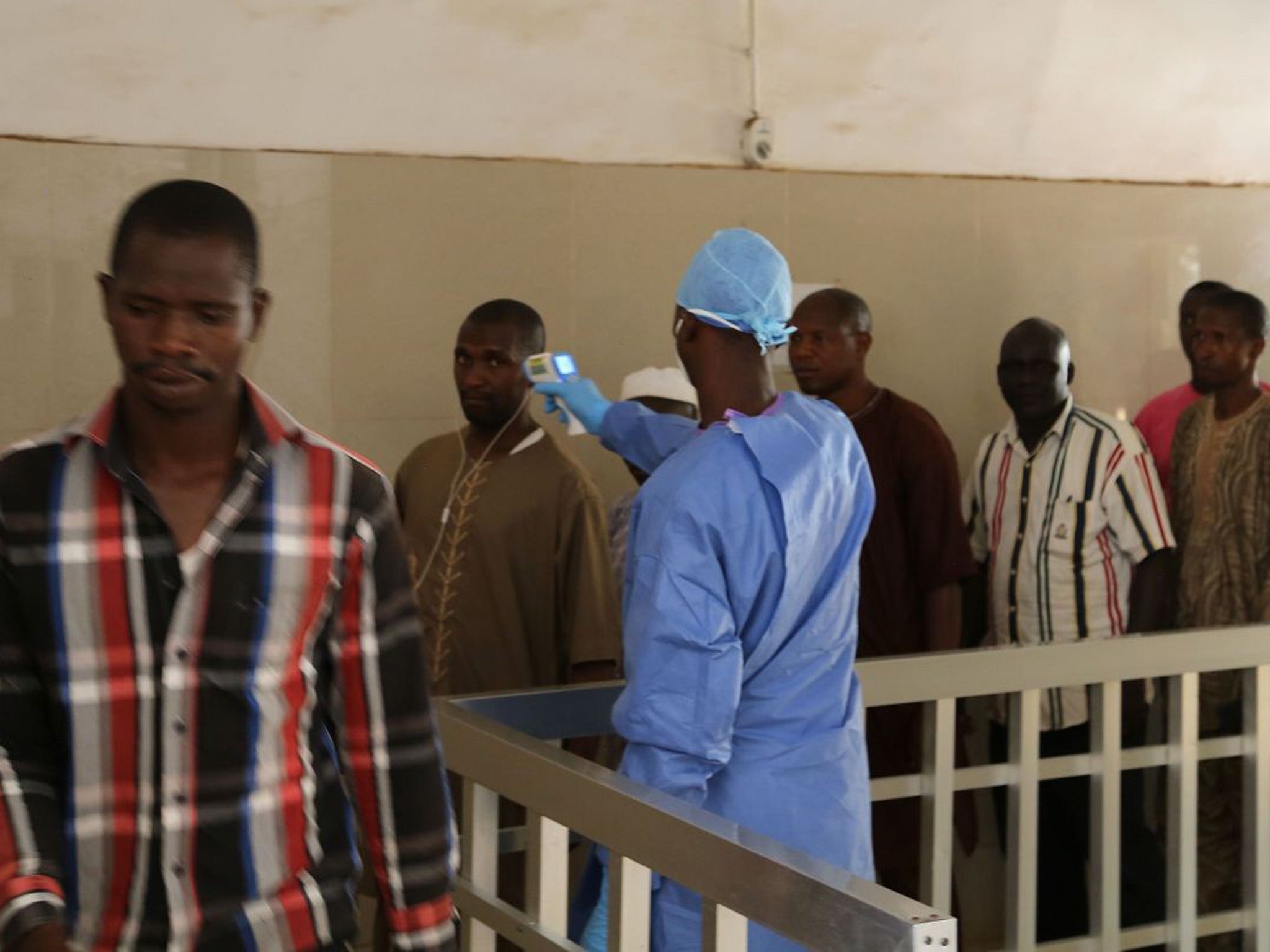 Health workers testing to see if people have Ebola in Guinea