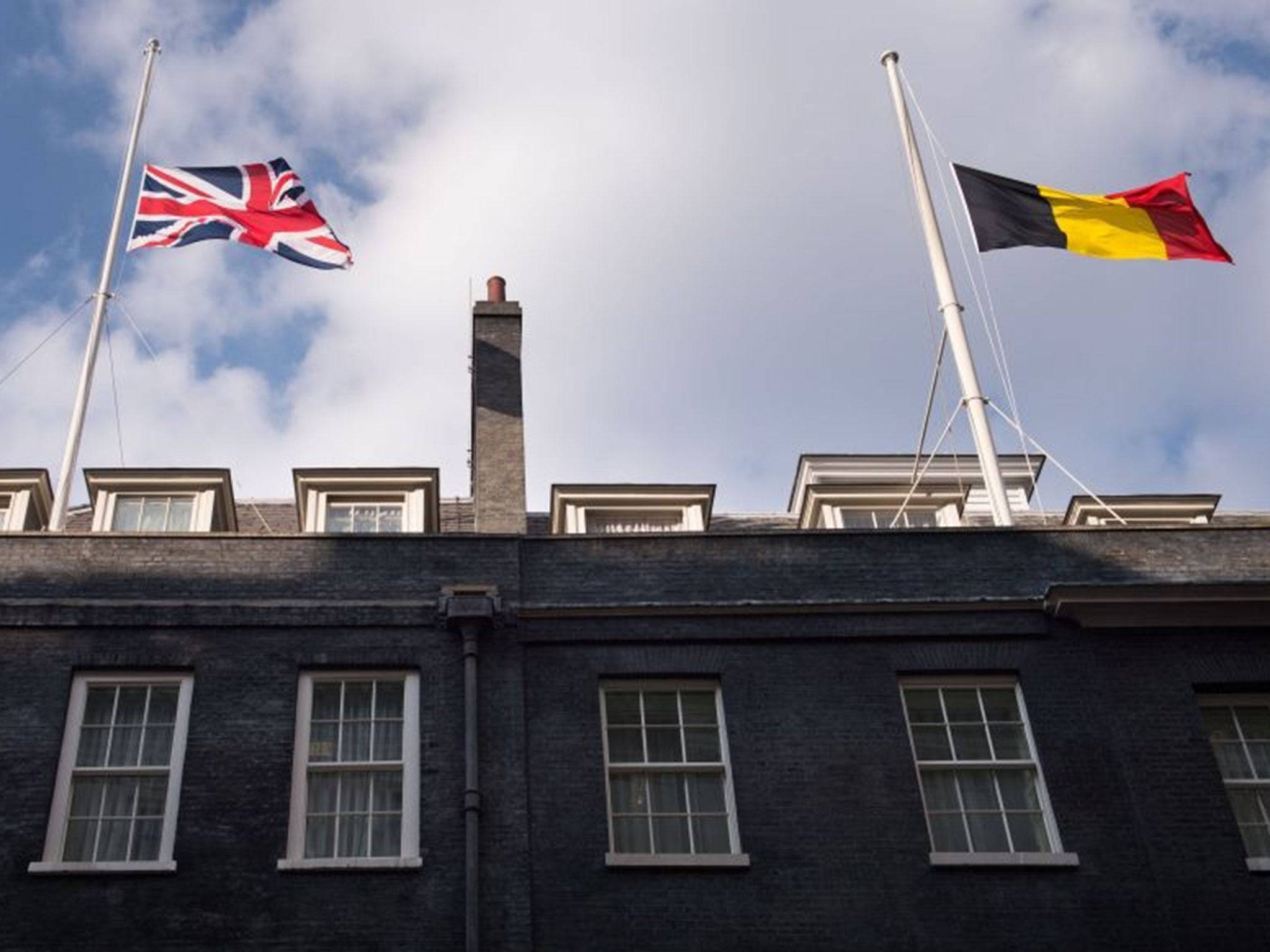 The Belgian flag flies at half mast above 10 Downing Street in London