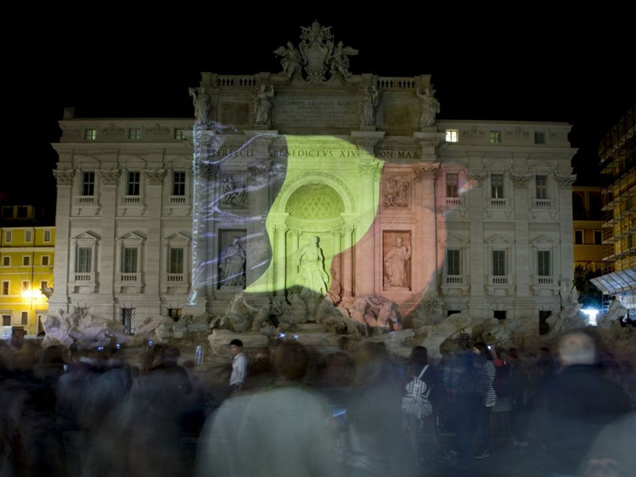 The Belgian flag is projected on Rome's historical Trevi Fountain