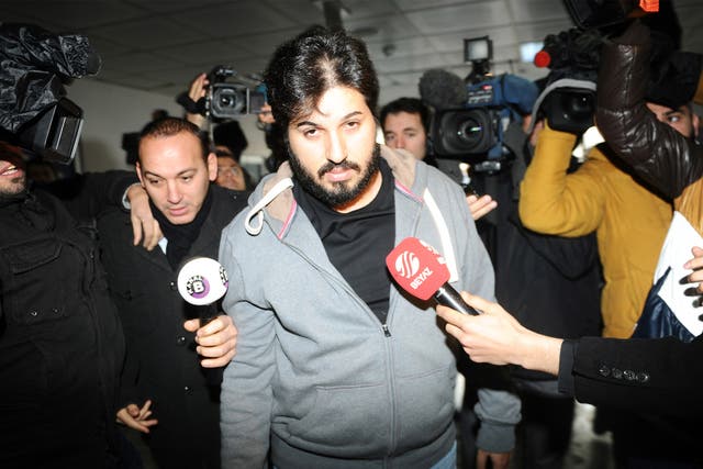 Reza Zarrab is surrounded by journalists at a police station in Istanbul in December 2013, in an inquiry that led to the resignation of three cabinet ministers