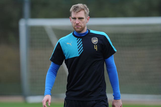 Plans to extend Per Mertesacker's contract have been delayed by Arsenal