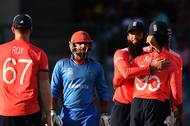 England celebrate after claiming a 15-run victory over Afghanistan