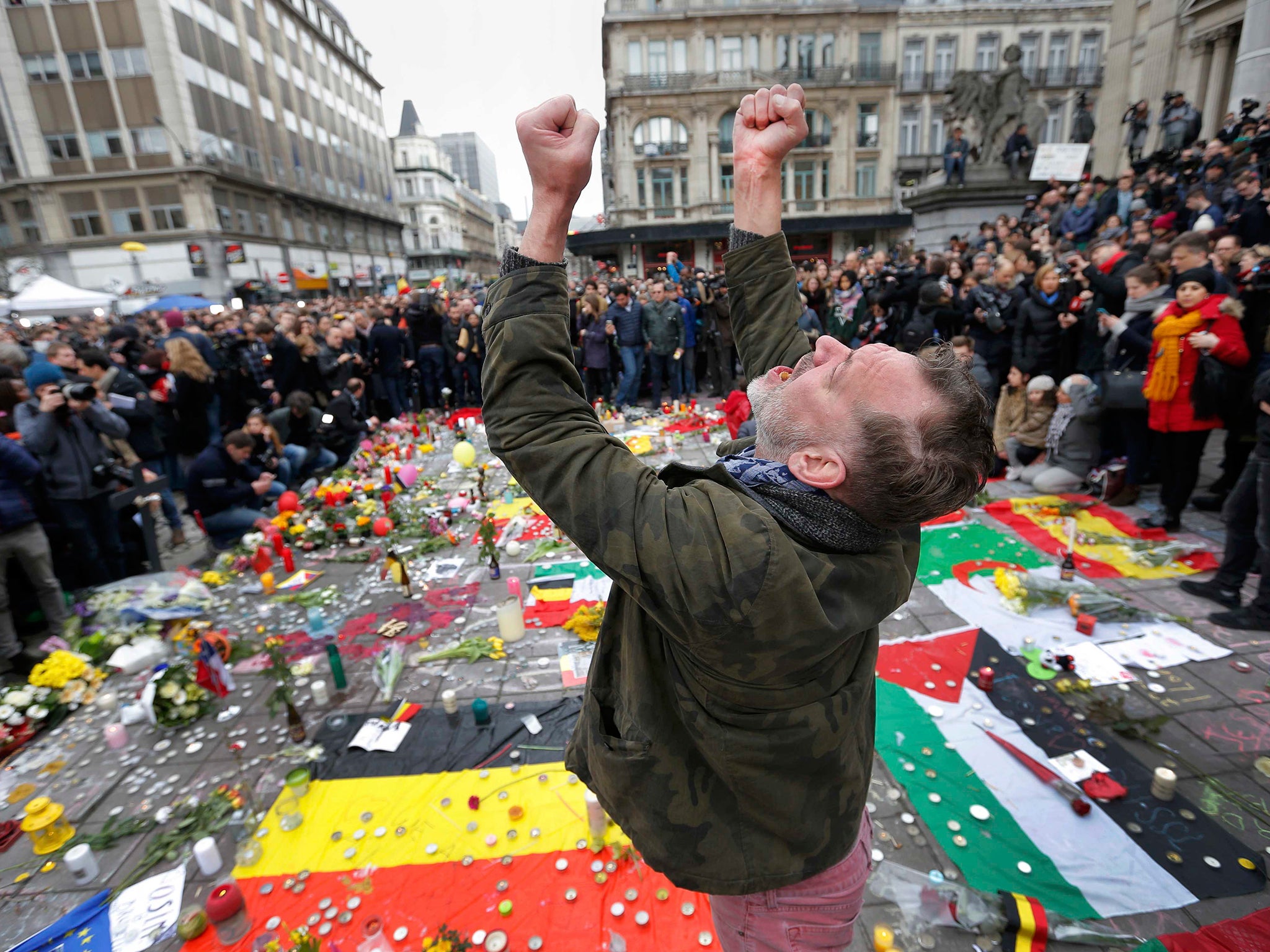 A man reacts at a street memorial following the bomb attacks in Brussels, Belgium
