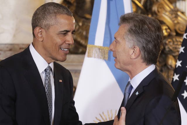 President Barack Obama talks with his Argentine counterpart, Mauricio Macri, at the end of a joint news conference at the Casa Rosada Presidential Palace in Buenos Aires