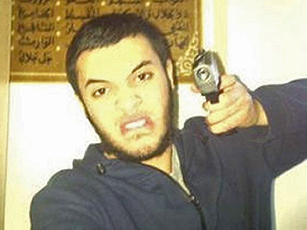 An image of Tarik Hassane posing with a handgun that was found on Suhaib Majeedís' mobile phone