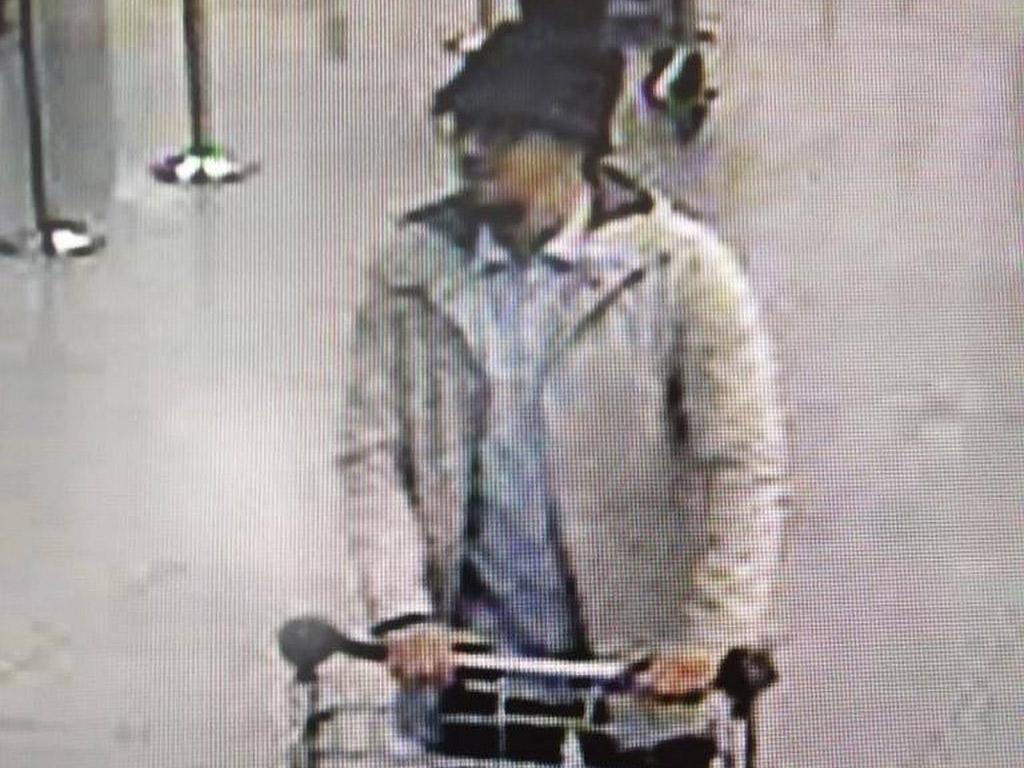 Abrini says he is this man, pictured pushing a trolley carrying explosives in Brussels airport