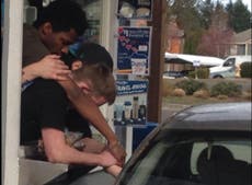 Photo captures moment coffee shop employees comfort grieving widow