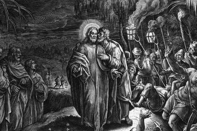 Biblical scene showing Judas betraying Jesus with a kiss