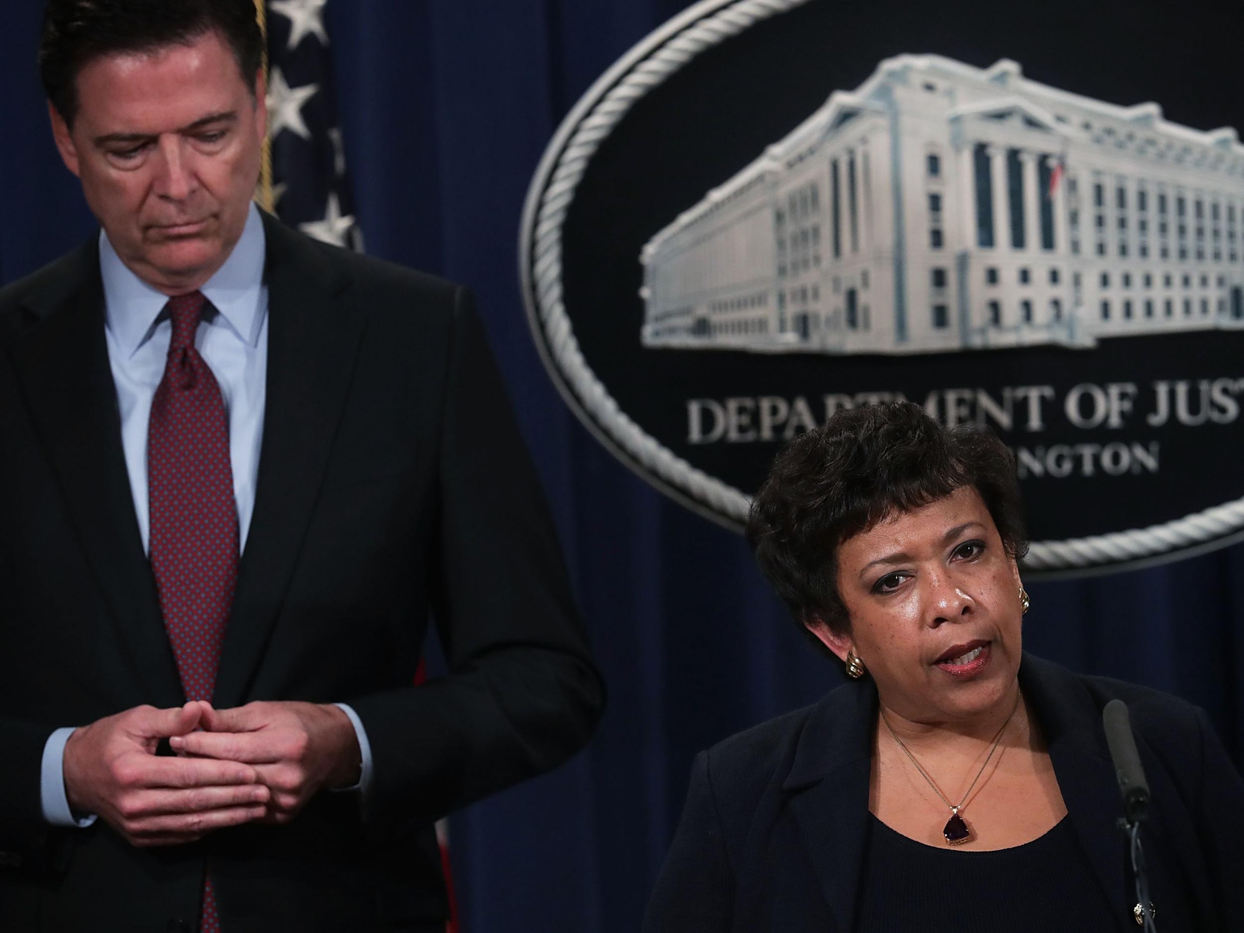 FBI director James Comey, standing behind US Attorney General Loretta Lynch, apparently ignored warnings from the justice department about going public Alex Wong/Getty Images