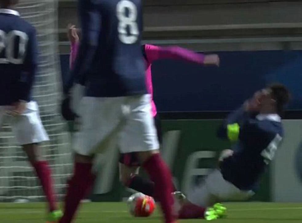 Aymeric Laporte goes down to the ground in pain after hurting his right leg