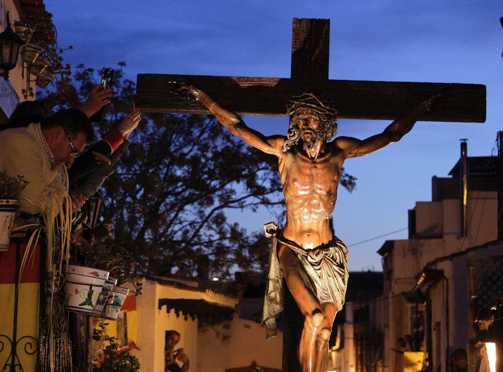An Easter procession featuring Jesus on a cross