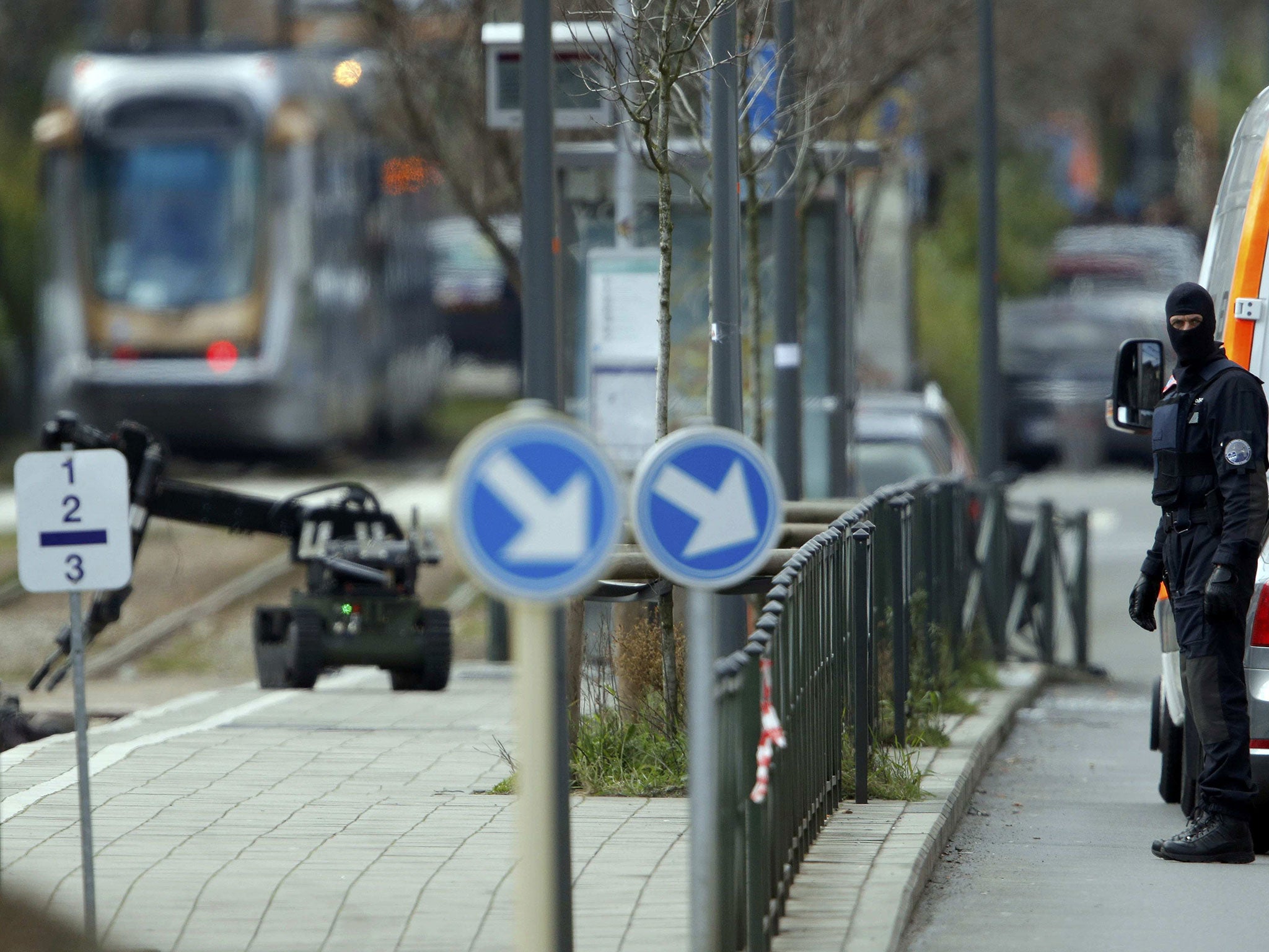 Police use a robotic device as they take part in a search in the Brussels borough of Schaerbeek following Tuesday's bombings in Brussels, Belgium, March 24, 2016.