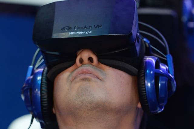 A man uses a prototype of the Rift at CES 2014