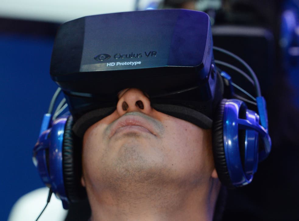 A man uses a prototype of the Rift at CES 2014