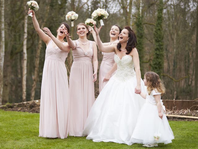 Bridesmaids traditionally wear similar or identical dresses