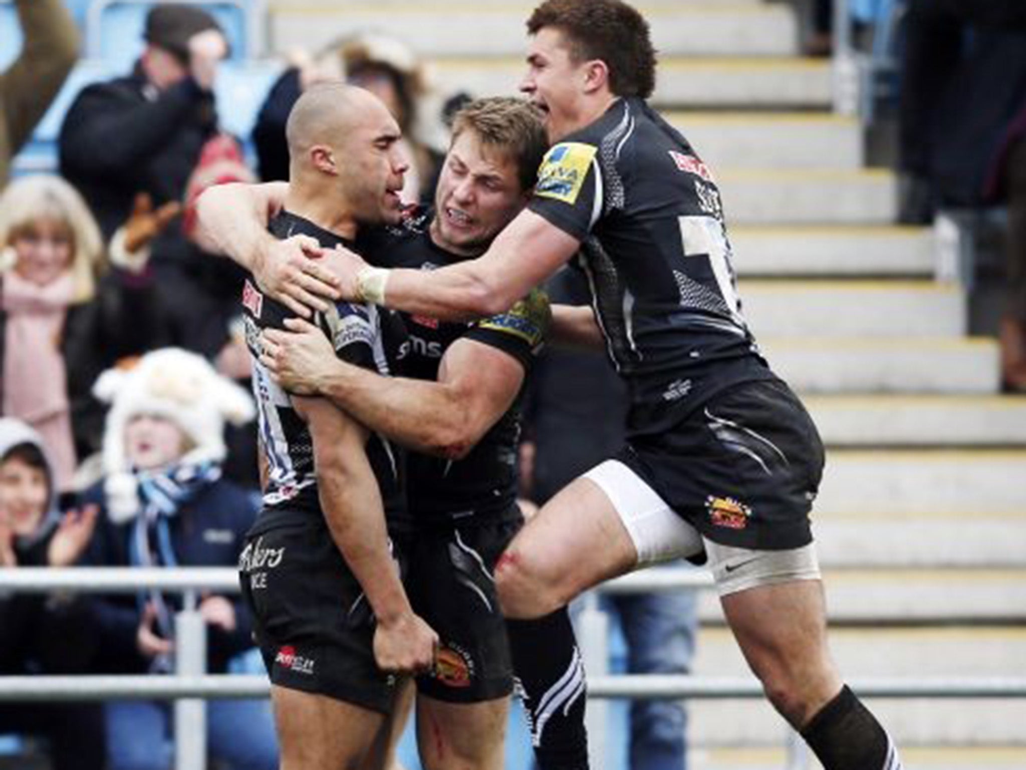 Olly Woodbury receives the congratulations of his Exeter Chiefs team-mates after scoring against Northampton in last week’s win