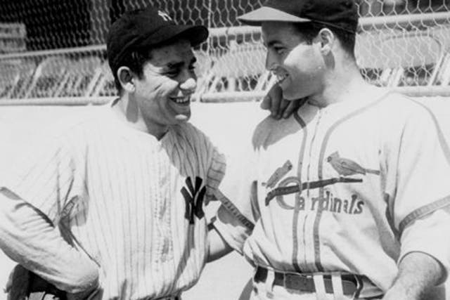 Yogi Berra (left) chats with Joe Garagiola at Yankee Stadium in 1947