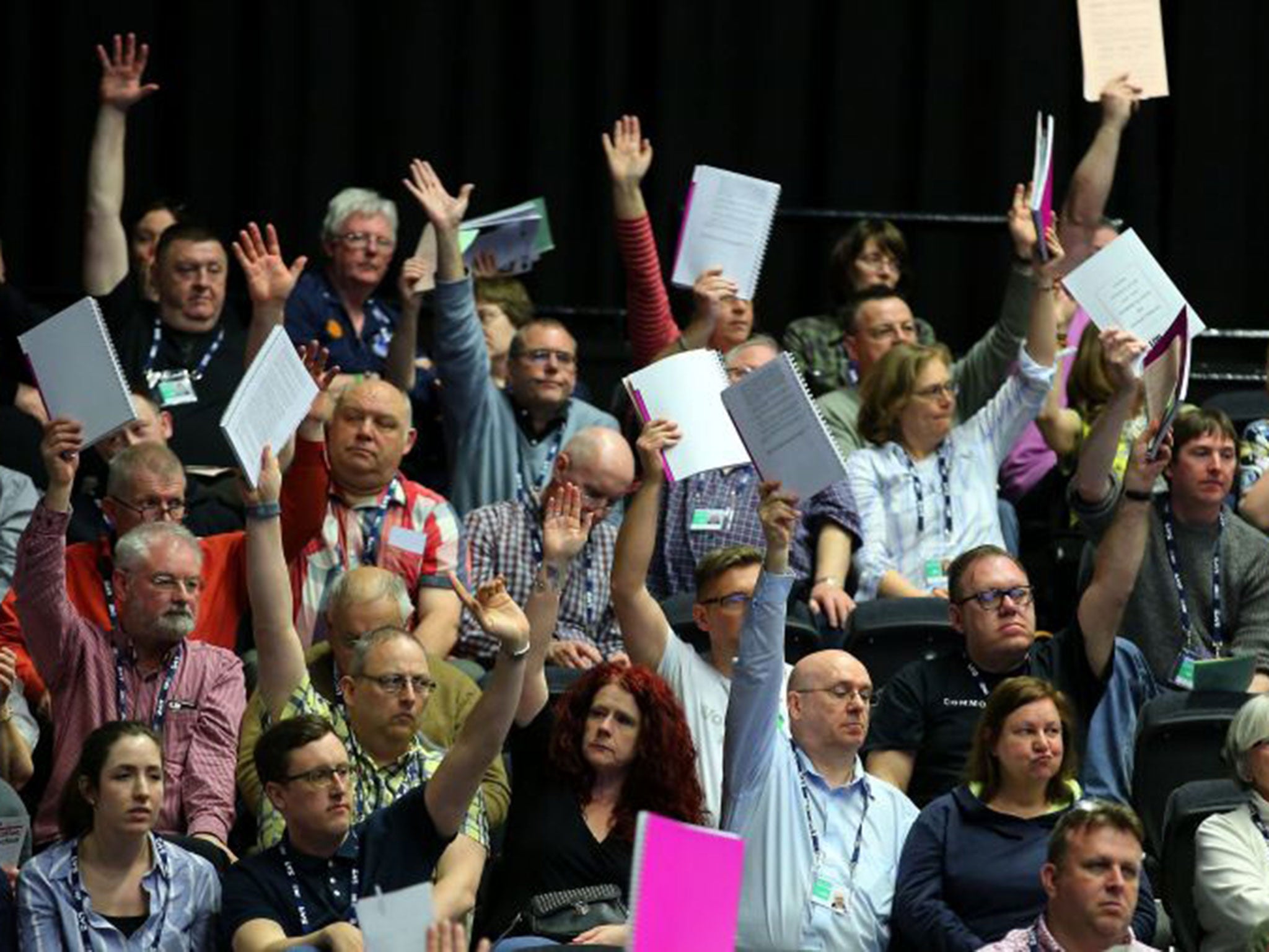 Delegates vote on a motion during the National Union of Teachers conference at the Brighton Centre