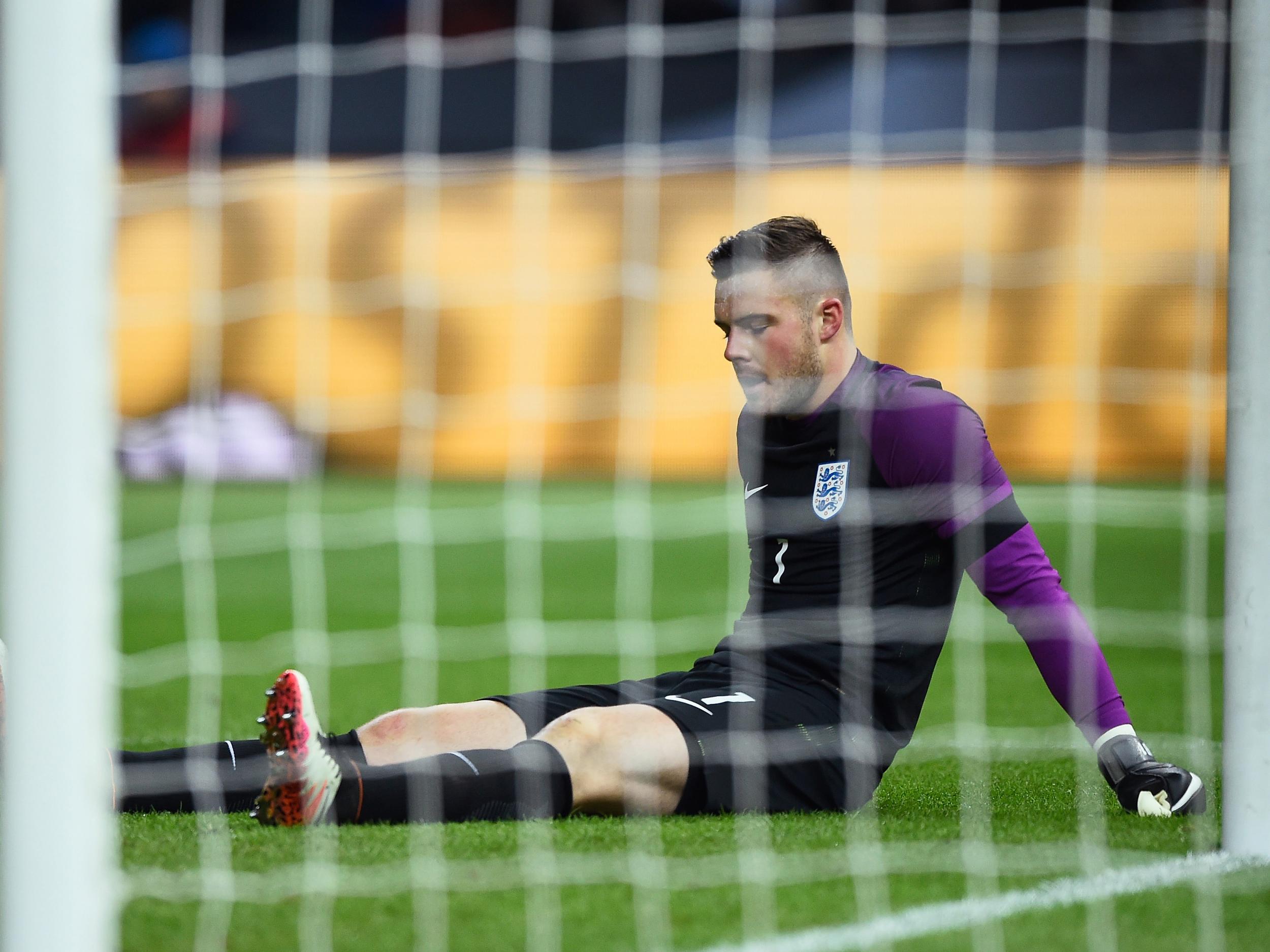 Jack Butland appears dejected after sustaining an ankle injury against Germany