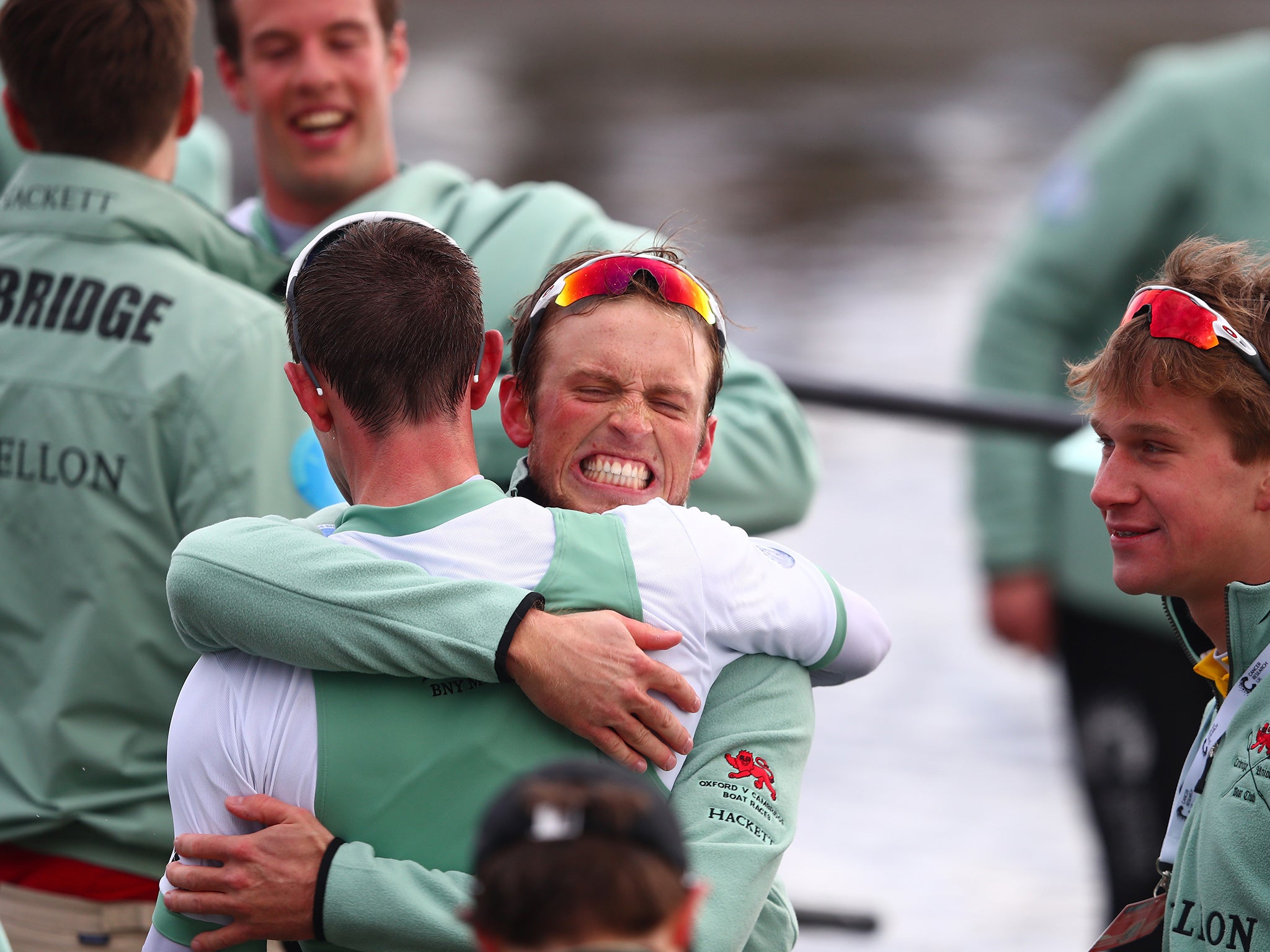 The Cambridge crew celebrate following their victory during The Cancer Research UK Boat Race