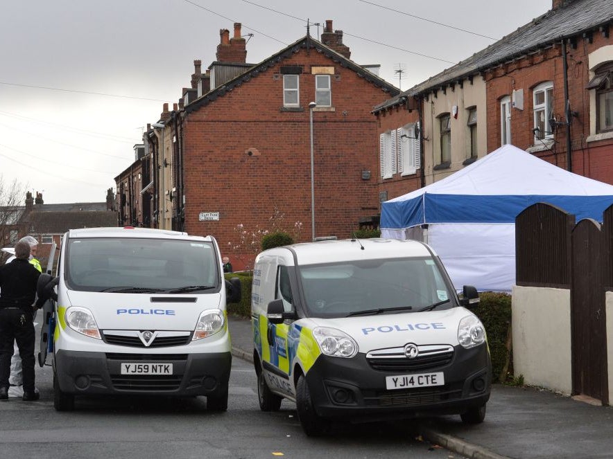 Police at a property in East Park Street, Leeds, where three bodies were found