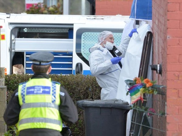 Police at a property in East Park Street, Leeds, where three bodies were found