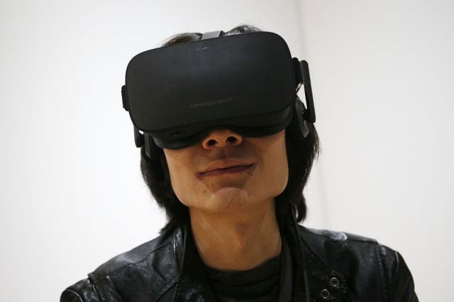 A man uses the Oculus Rift at CES 2016 in Las Vegas