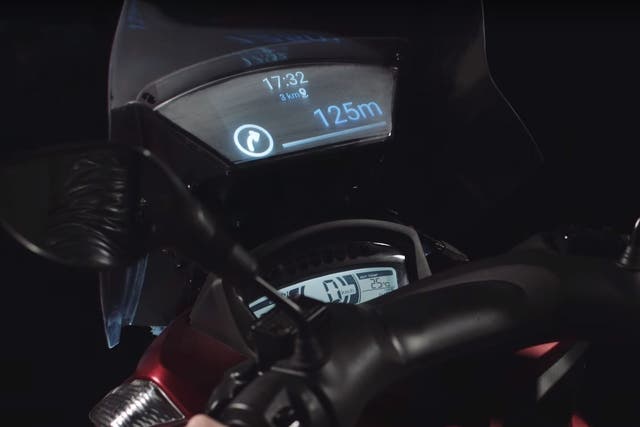 The scooter's head-up display gives directions and message alerts