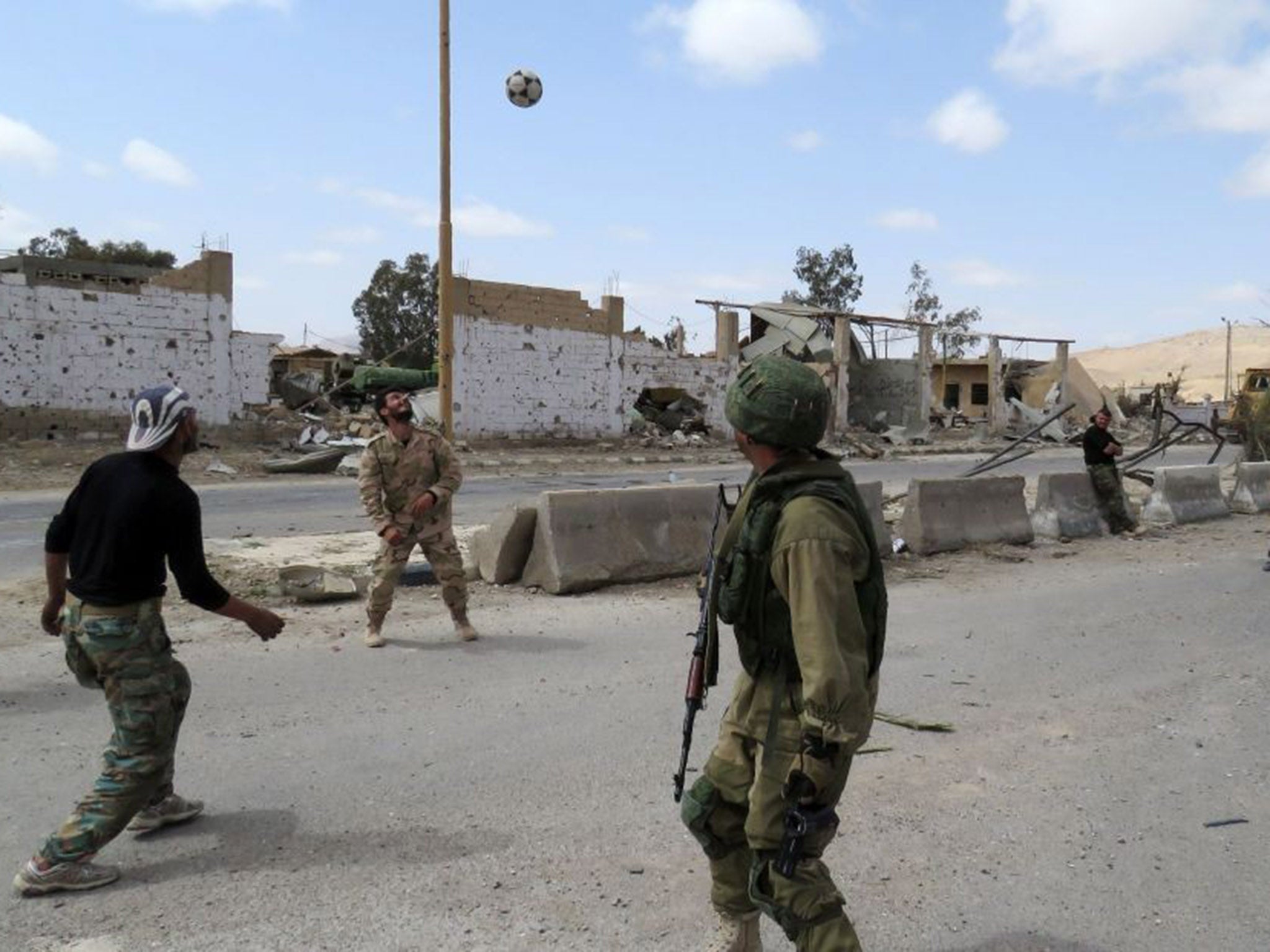 Syrian soldiers were recorded playing football while still in their combat gear
