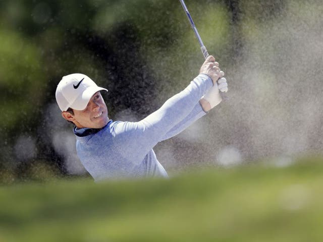 Rory McIlroy plays out of a bunker on the 18th hole during his semi-final defeat by Jason Day in the WGC-Dell Match Play