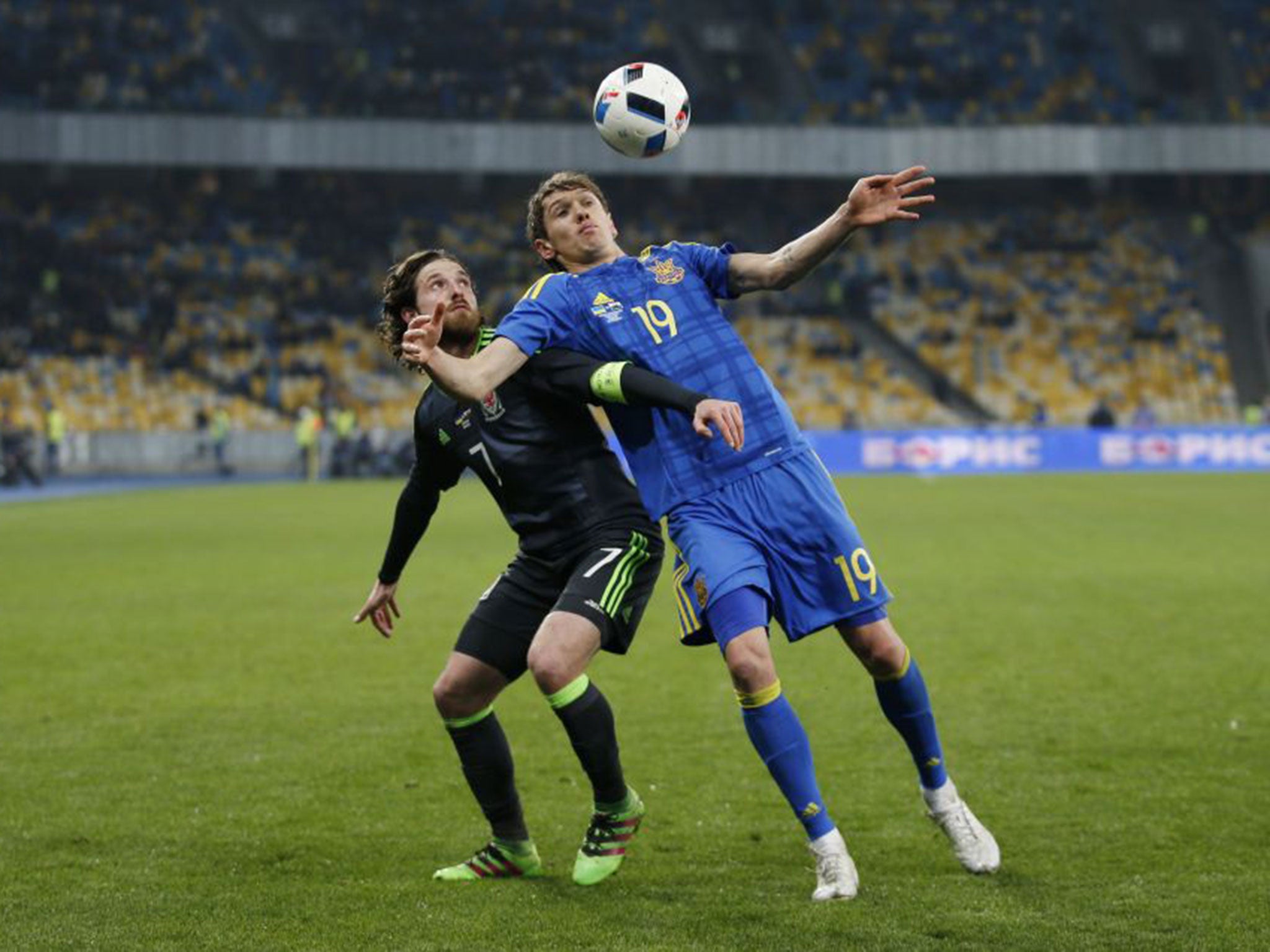 Wales midfielder Joe Allen battles for possession with the Ukraine’s Denis Garmash during the friendly defeat for Chris Coleman’s side