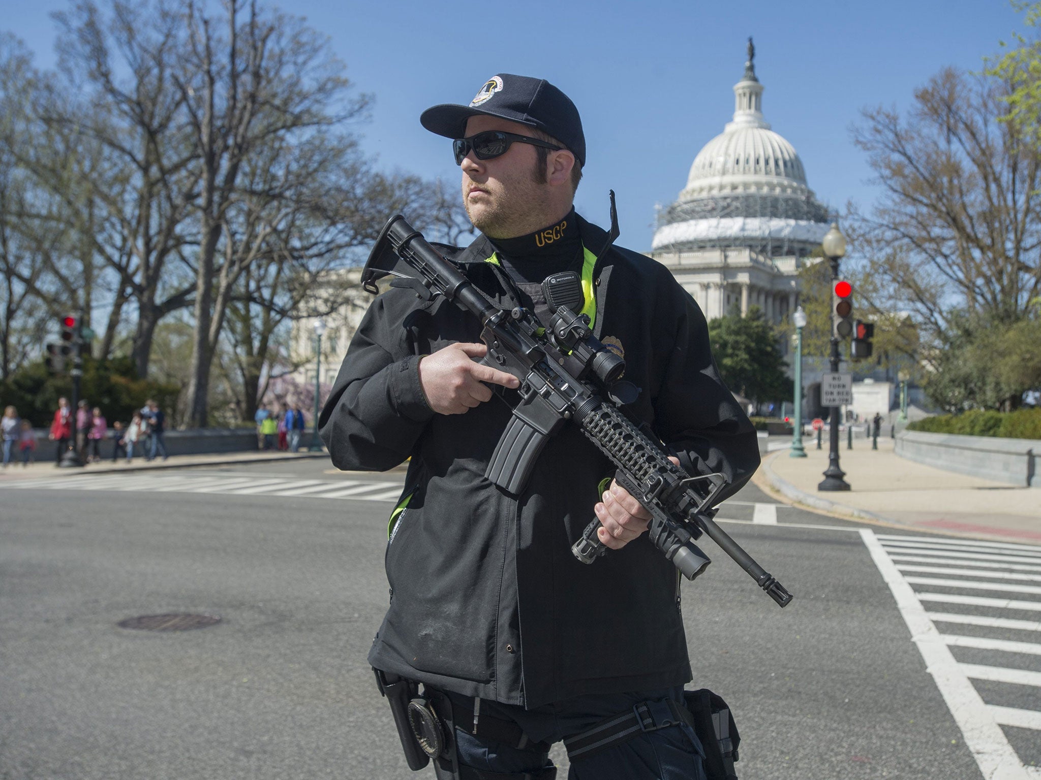 A Capitol police officer secures the area after a man opened fire at the complex