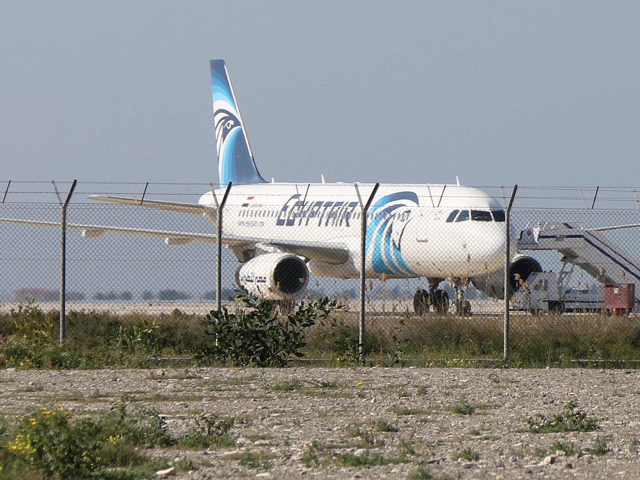 An Egypt Air Airbus A-320 sits on the tarmac of Larnaca aiport after it was hijacked and diverted to Cyprus