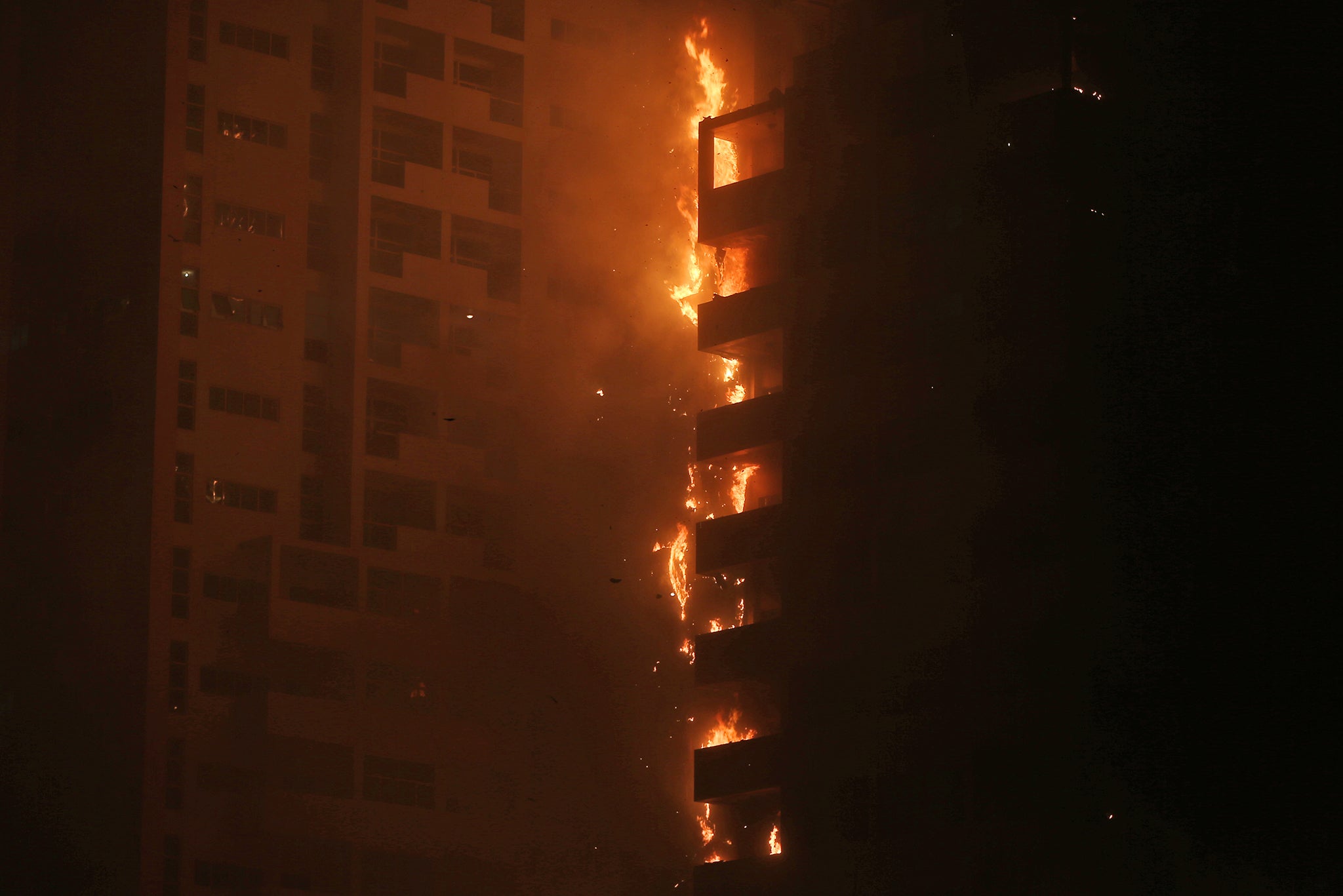 Fire and smoke billow from a high-rise building in Ajman, United Arab Emirates