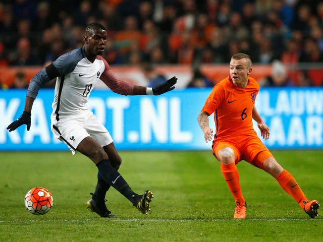 Jordy Clasie in action against Paul Pogba of France