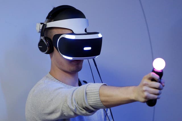 A man uses the PlayStation VR at Paris Games Week in 2015