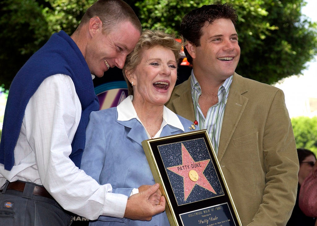 Patty Duke, center, with her sons Sean and MacKenzie Astin (left).