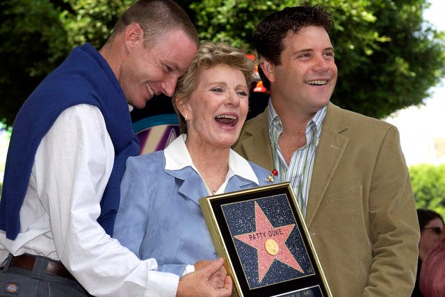 Patty Duke, center, with her sons Sean and MacKenzie Astin (left).