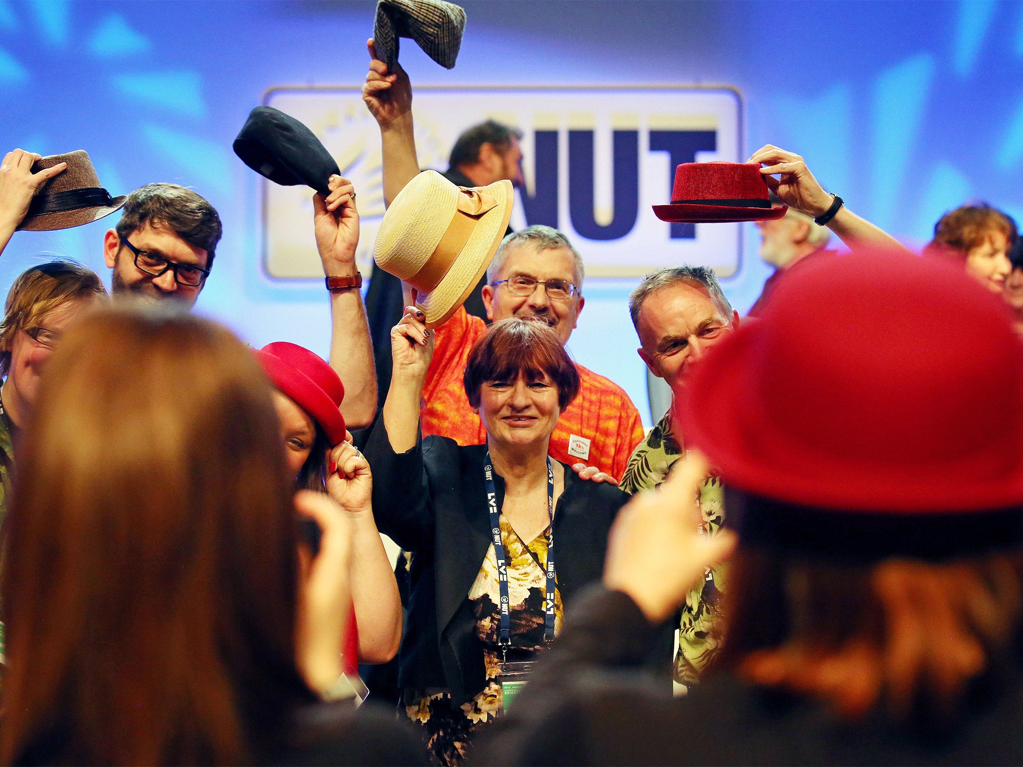 General Secretary Christine Blower is joined on stage by delegates at the end of the conference in Brighton