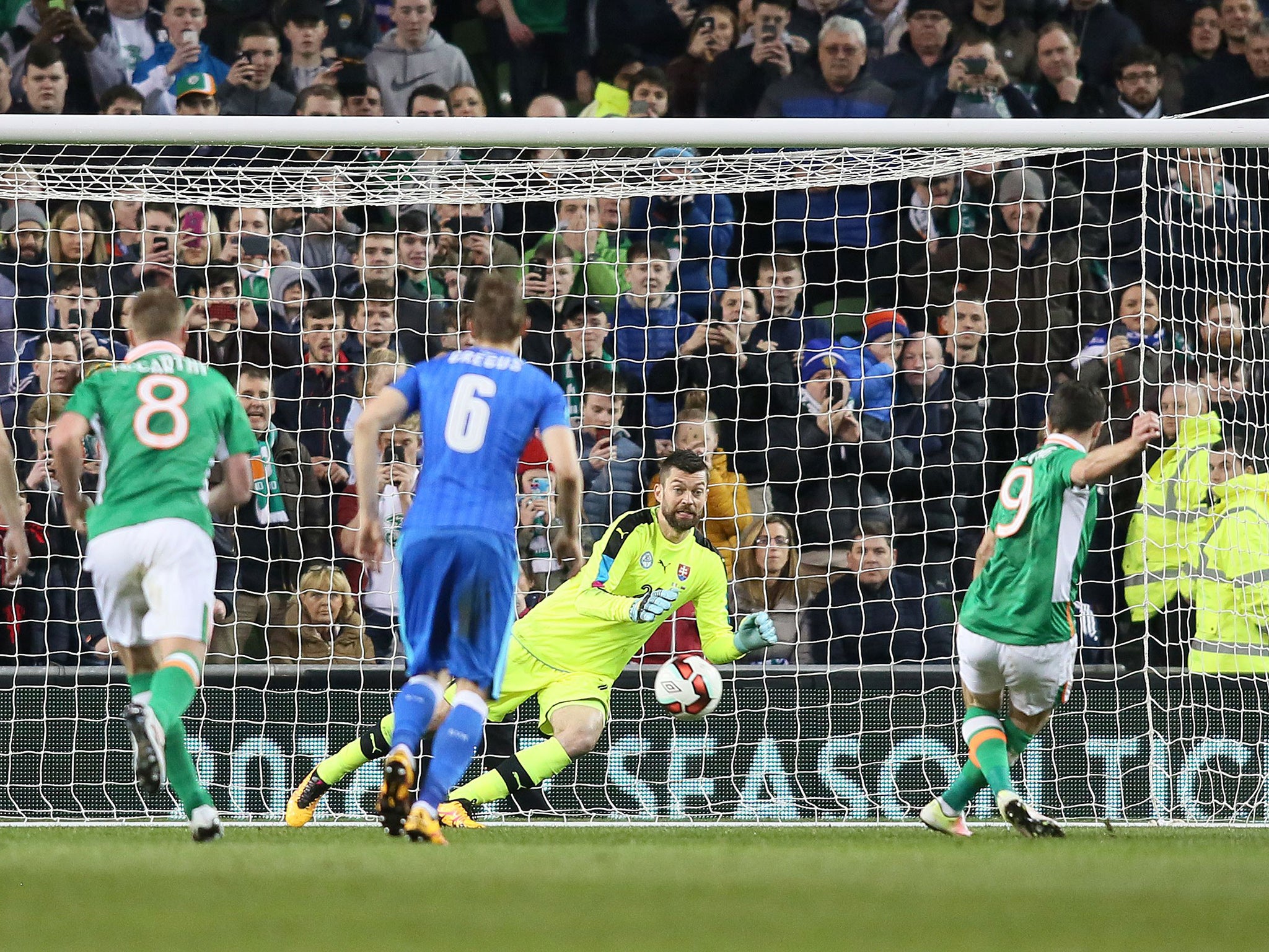 Shane Long scores the opening goal from the penalty spot for Ireland